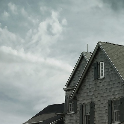 happy homeowner house exterior